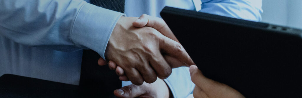 Close up of men shaking hands