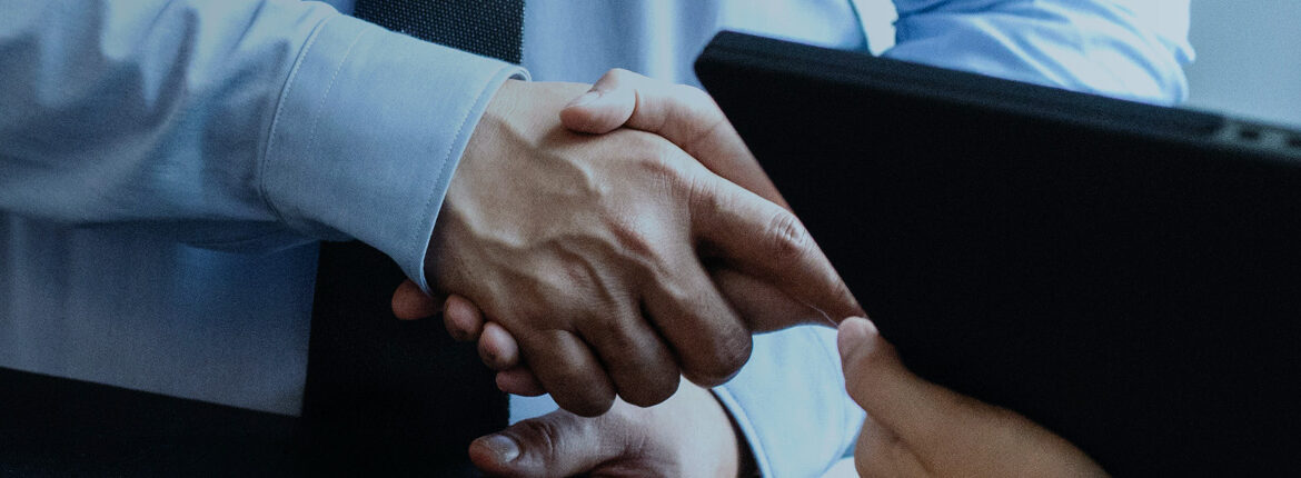 Close up of men shaking hands